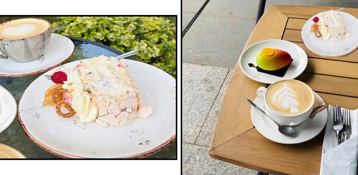 Gluten-free meringue cake and a fruit-shaped mango dessert with cappuccino at an outdoor cafe in Portugal.