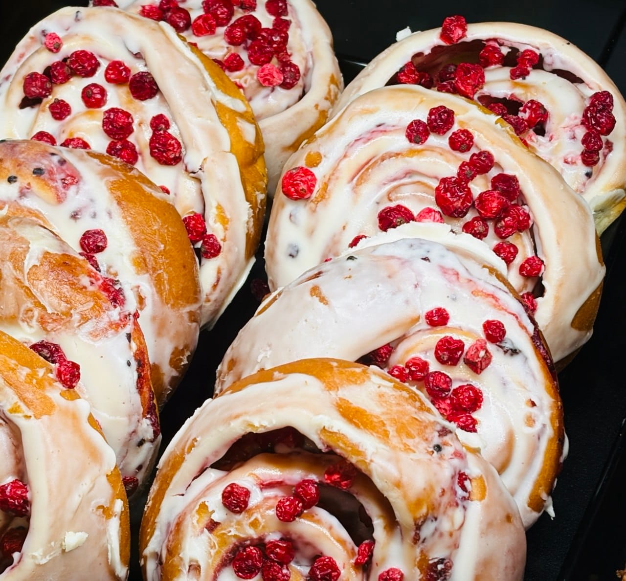 Gluten-free cinnamon rolls with cream cheese icing and dried berries, Salzburg