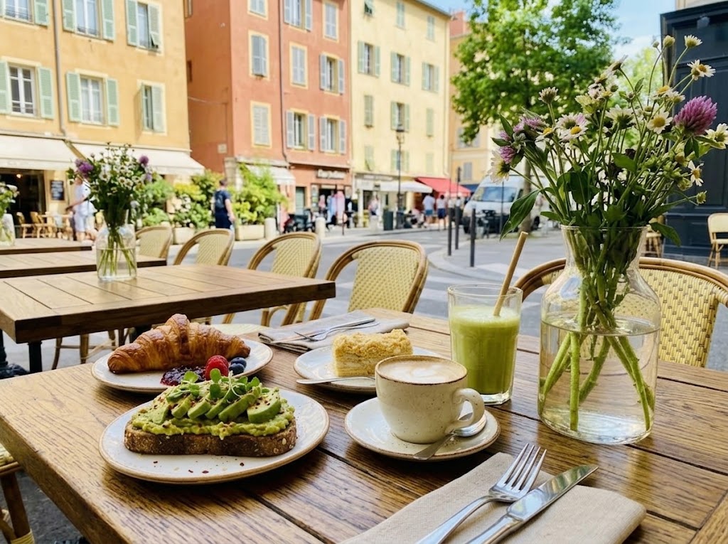 Vegan and gluten-free breakfast with avocado toast and coffee at a cafe in Nice.